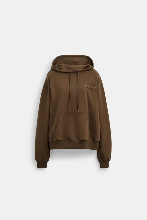 Matin Kim X Coach LOGO EMBROIDERY HOODIE IN BROWN