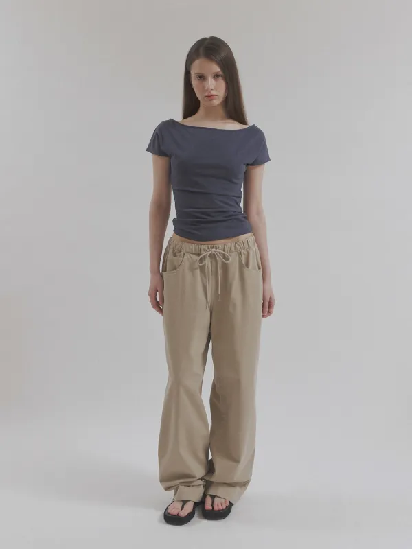 worn cotton pants (beige)