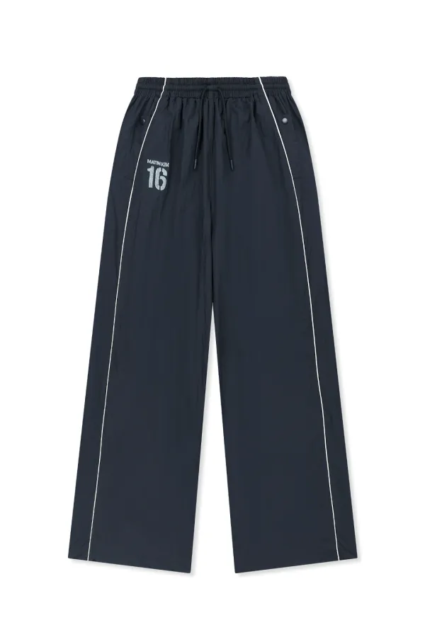 MATIN 16 LOGO TRACK PANTS IN NAVY