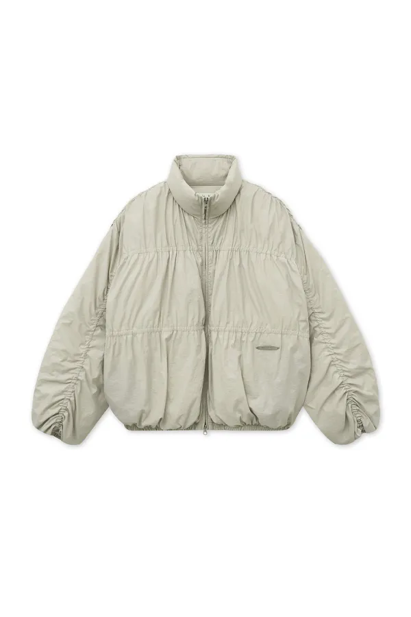 HIGH NECK SHIRRING DOWN JUMPER IN LIGHT BEIGE