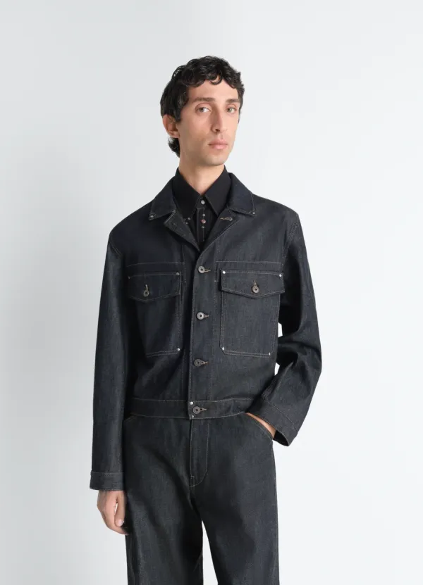 TRUCKER JACKET WITH STUDS IN DENIM